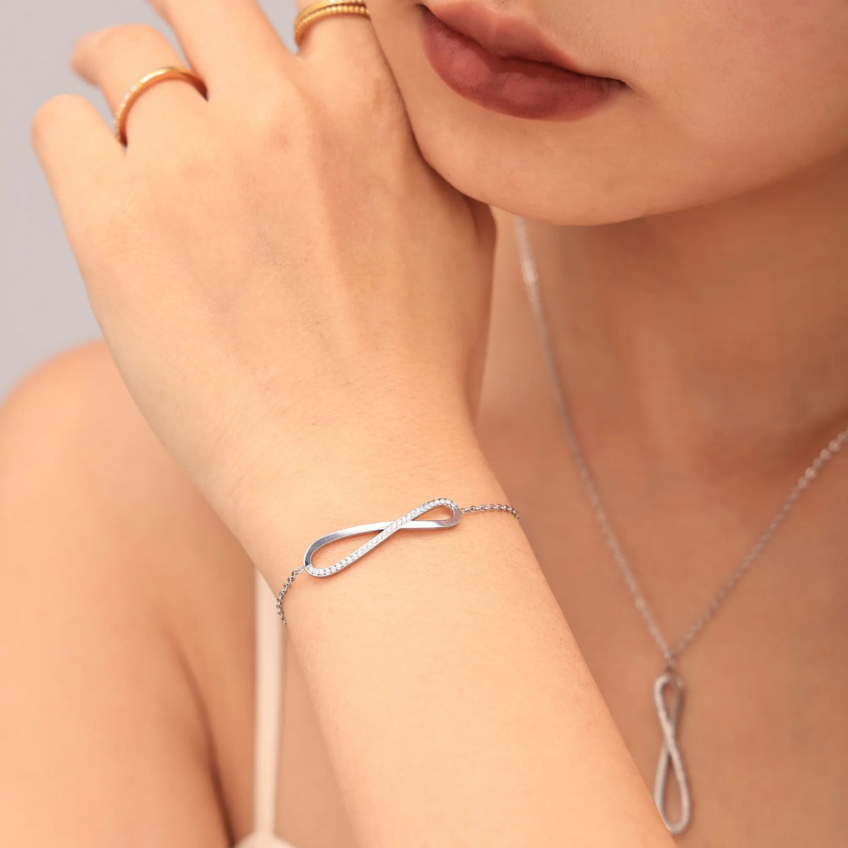 CZ Pave Infinity Loop Pendant Necklace & Curved Bar Bracelet Set